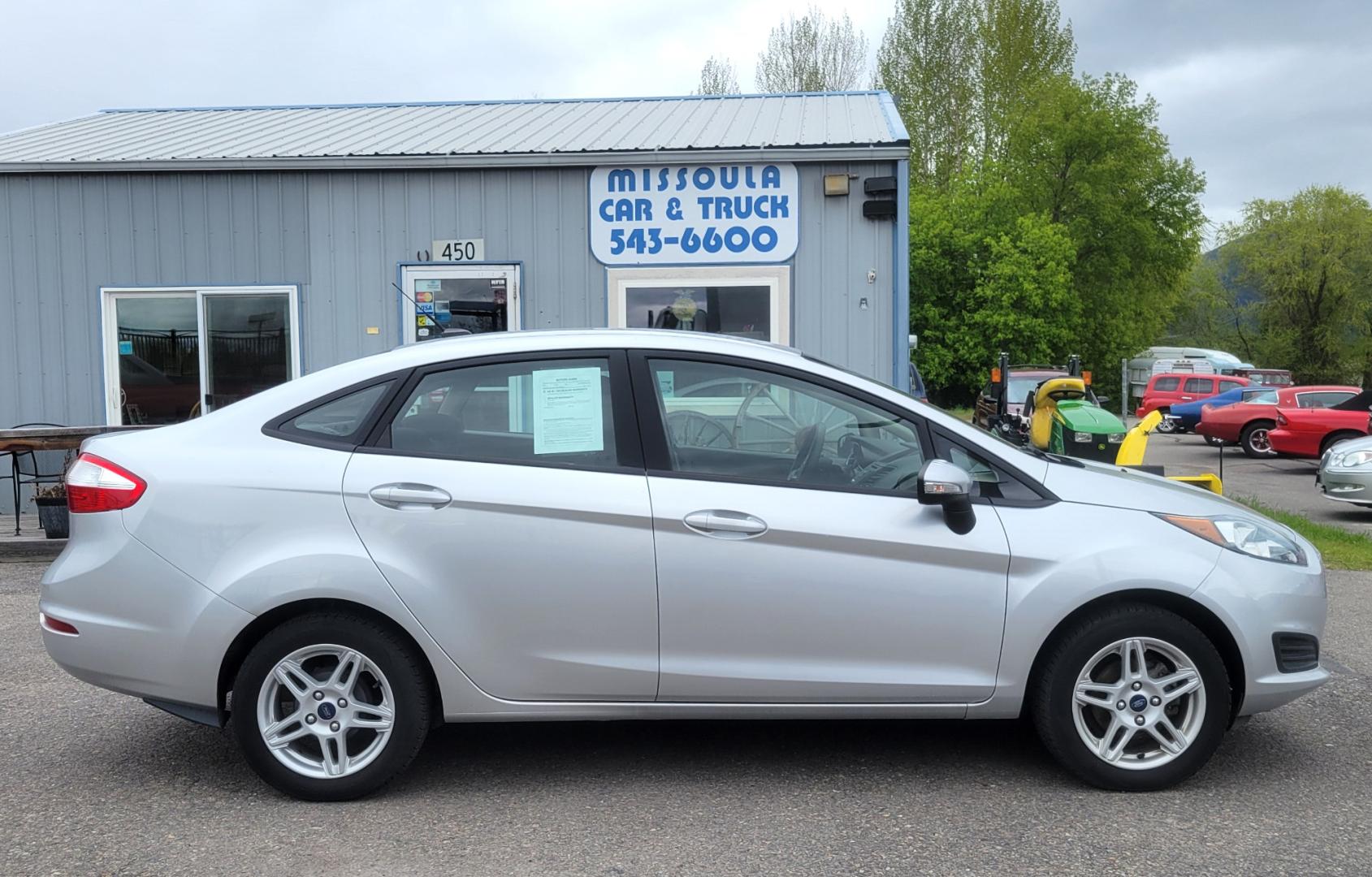 2019 Silver Ford Fiesta SE Sedan (3FADP4BJ2KM) with an 1.6L L4 DOHC 16V engine, Automatic transmission, located at 450 N Russell, Missoula, MT, 59801, (406) 543-6600, 46.874496, -114.017433 - Great little Economy Car in Very Good Condition. Low Miles. Automatic Transmission. Air Conditioning. Heated Seats. Power Windows. Cruise. Tilt. Backup Camera. - Photo#0